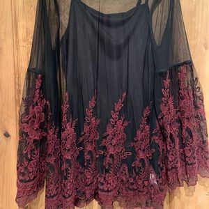 Sheer with bell sleeves. Embroidered flowers.